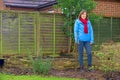 Standing beside two new pear trees, planted in January, 2026. Royalty Free Stock Photo