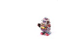 standing vintage tin robot without key on white background space to insert text / word Royalty Free Stock Photo