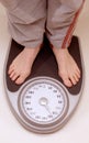 Standing on weight scale Royalty Free Stock Photo