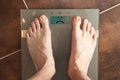 Standing on the weight scale. Overweight / underweight.