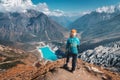 Standing woman with backpack on the mountain peak Royalty Free Stock Photo