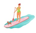 Standing woman is paddling with paddle board on the water with pet dog Royalty Free Stock Photo