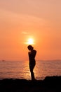 Standing woman silhouette on sea background Royalty Free Stock Photo