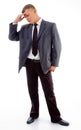 Standing young businessman in tension