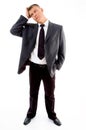 Standing young confused businessman