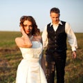 Stands beautifully - bride poses while a groom walks to her on t