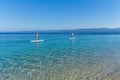 Standup paddle boarders at Zlatni Rat beach, Croatia