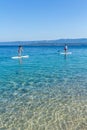 Standup paddle boarders at Zlatni Rat beach, Croatia