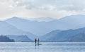 Standup paddleboarding on the Pheva lake in Himalaya