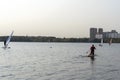 Standup paddleboarding are on the river Moscow, Strogino