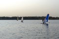 Standup paddleboarding are on the river Moscow, Strogino