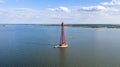Stanislav-Adzhigol lighthouse in landscape with water on blue sky with clouds. Ukraine Royalty Free Stock Photo