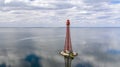 Stanislav-Adzhigol lighthouse in landscape with water on blue sky with clouds. Ukraine Royalty Free Stock Photo