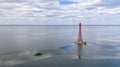 Stanislav-Adzhigol lighthouse in landscape with water on blue sky with clouds. Ukraine Royalty Free Stock Photo