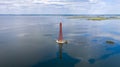 Stanislav-Adzhigol lighthouse in landscape with water on blue sky with clouds. Ukraine Royalty Free Stock Photo