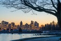 Stanley Park Seawall in dusk. Vancouver downtown skyline in the background. Canada. Royalty Free Stock Photo