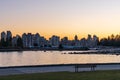 Stanley Park Seawall in dusk. Vancouver downtown skyline in the background. Canada. Royalty Free Stock Photo