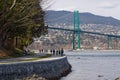 Stanley Park seawall with iconic Lions Gate Bridge Royalty Free Stock Photo