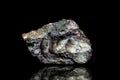 Stannite, tin and copper iron ore, raw rock on black background, mining and geology Royalty Free Stock Photo