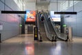 06/09/2021. Stansted Airport, UK. A few passengers with hand luggage on escalators heading towards departure gates.