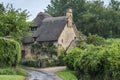 Thatched cottage in the village of Stanton, Cotswolds district of Gloucestershire. It`s built almost completely of Cotswold stone