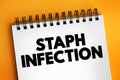 Staph Infection - are caused by staphylococcus bacteria, medical text concept on notepad Royalty Free Stock Photo