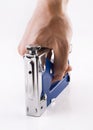 Staple gun in man's arm over white Royalty Free Stock Photo