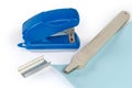 Staple remover on stapled sheets, new staples, small paper stapler Royalty Free Stock Photo