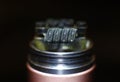 Staple staggered fused clapton coil in vaping rebuildable dripping atomizer Royalty Free Stock Photo