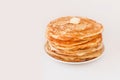 Staple of yeast fluffy pancakes with butter. Spring holiday Traditional Russian Shrovetide Maslenitsa week or pancake