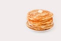 Staple of yeast fluffy pancakes with butter. Spring holiday Traditional Russian Shrovetide Maslenitsa week or pancake