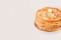 Staple of yeast fluffy pancakes with butter. Spring holiday Traditional Russian Shrovetide Maslenitsa week or pancake