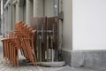 Stapled chairs and tables of a closed terrace restaurant with copy spacein Lucerne, Switzerland.