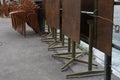 Stapled chairs and tables of a  closed terrace restaurant in Lucerne, Switzerland. Gastronomy establishments are under lockdown. Royalty Free Stock Photo