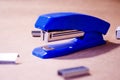 Stapler. Stapler blue. Stapler and staples. Stapler is on the table. Office. Office stapler Royalty Free Stock Photo