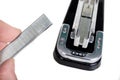 Stapler for fastening sheets of paper and staples. Office accessories for working behind the desk. Royalty Free Stock Photo