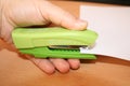 The stapler in his hand fastens the documents Royalty Free Stock Photo