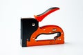 Stapler household new orange, reliable Royalty Free Stock Photo