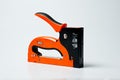 Stapler household new orange, reliable Royalty Free Stock Photo