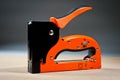 Stapler household new orange, reliable Royalty Free Stock Photo