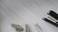 Stapler and its accessories on a table Royalty Free Stock Photo