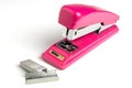 Stapler and metal staple concept over white background