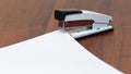 Stapler near white sheets of paper, copy space_