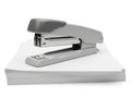 Stapler on paper stack isolated on white background Royalty Free Stock Photo