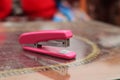 Stapler pink on the table, version 2 Royalty Free Stock Photo