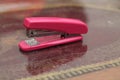 Stapler pink on the table, version 3 Royalty Free Stock Photo