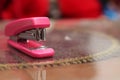 Stapler pink on the table, version 5 Royalty Free Stock Photo
