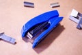 Stapler. Stapler blue. Stapler and staples. Stapler is on the table. Office. Office stapler Royalty Free Stock Photo