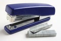 Stapler and staples over white Royalty Free Stock Photo