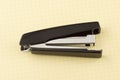 Stapler for stapling papers on a table Royalty Free Stock Photo